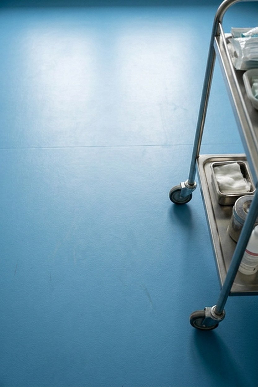 Sky blue vinyl flooring in a lash studio treatment area