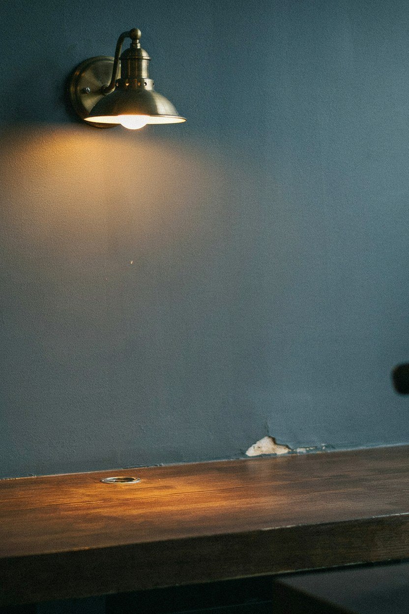 Warm task light over a studio coffee counter in the evening